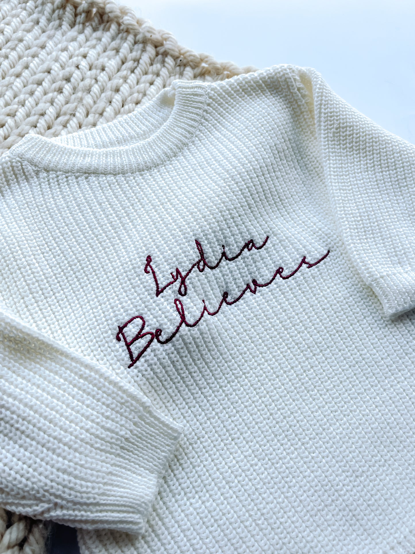 Personalised Baby Christmas Romper – “Name Believes” Embroidered Knitted Outfit